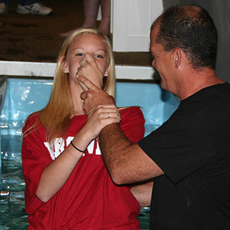 Ali is baptized by Darin Cummings